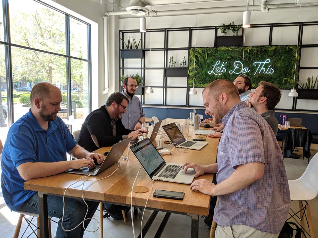 Some of the team working together at a recent co-working day