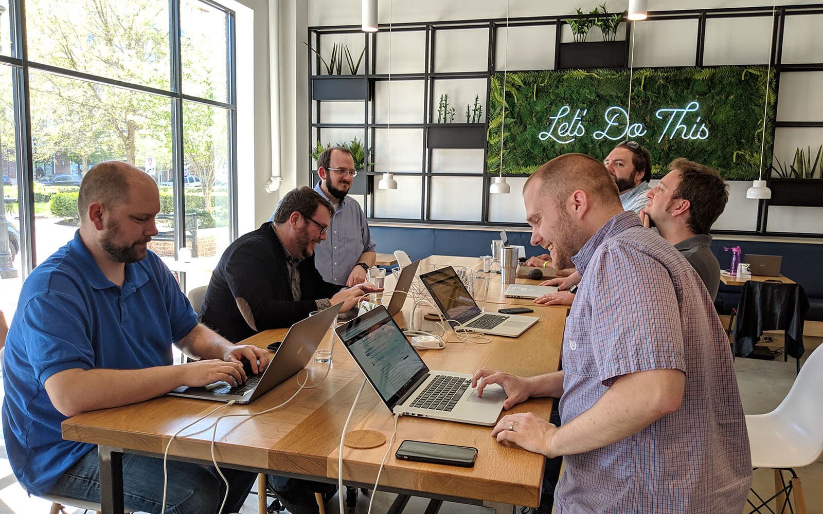 A few of the team working together at a recent co-working day
