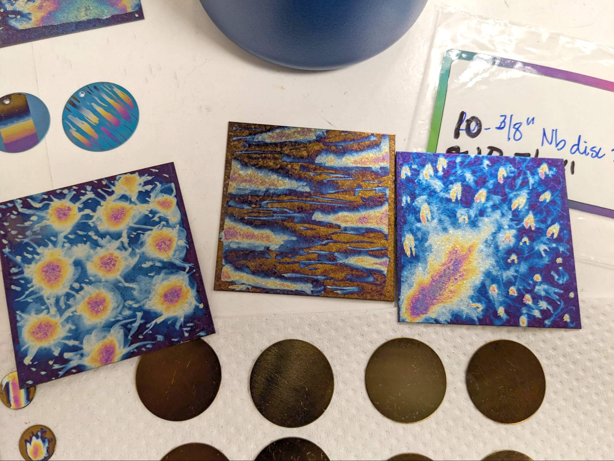 Work surface with various squares of brightly colored anodized metal
