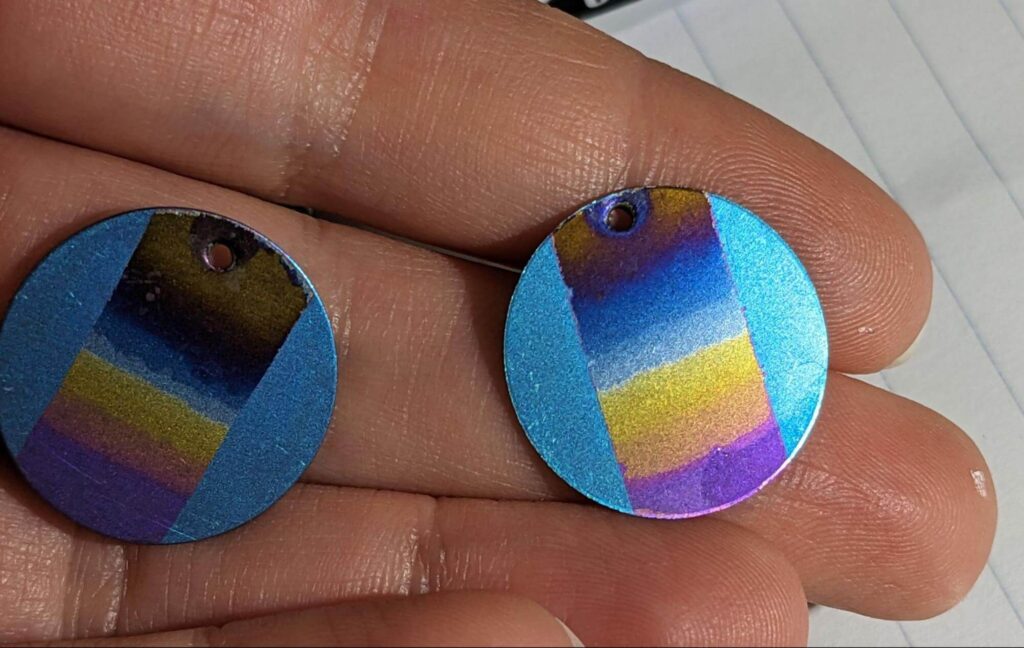 Blue metal disks featuring a rainbow gradient in the center and blue edges.